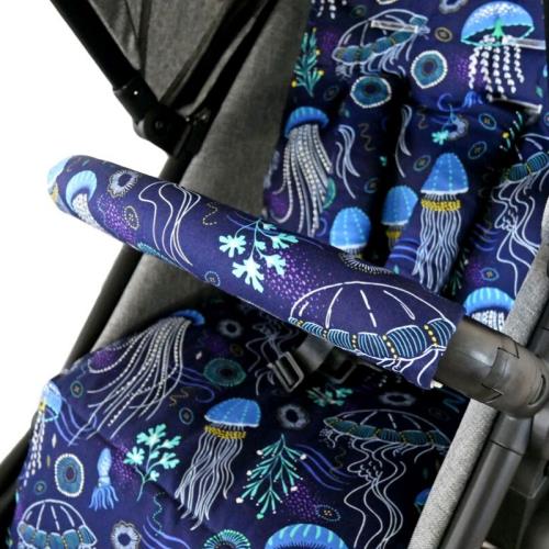 A close-up of the Into the Deep in Lagoon pram cover and matching belly bar cover
